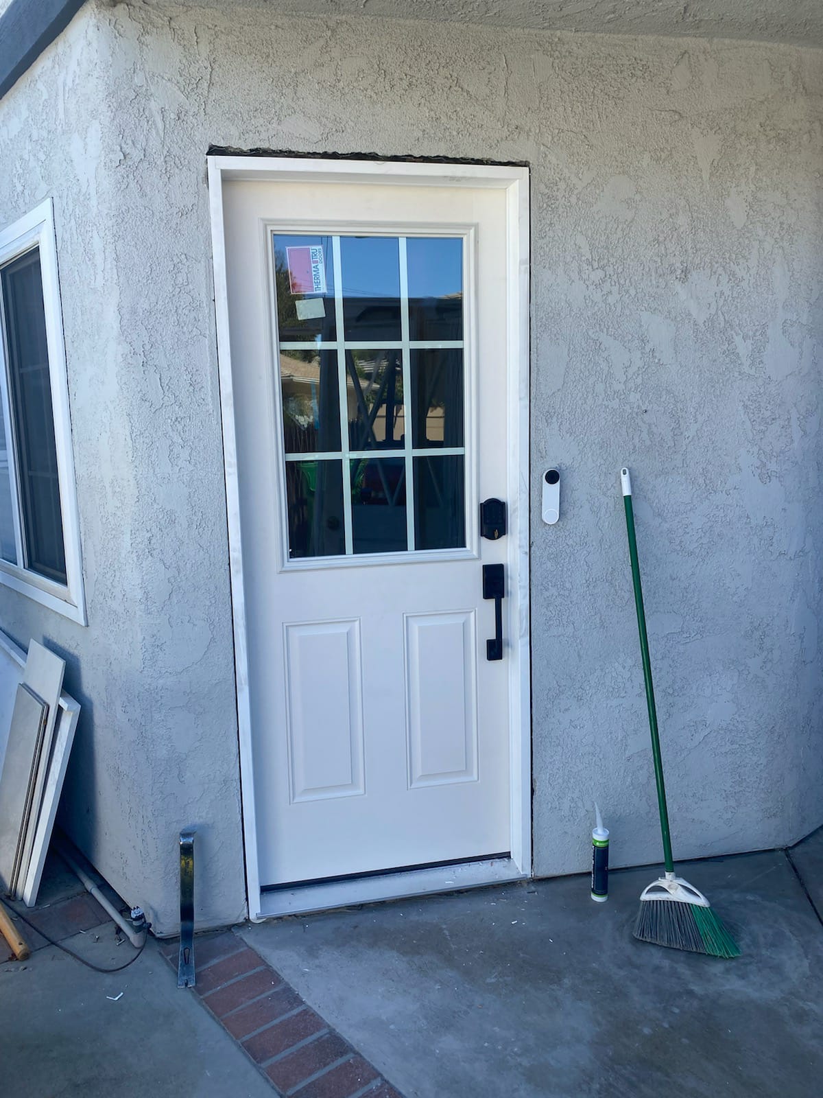 Half light fiberglass door with internal flat grids... bronze hardware